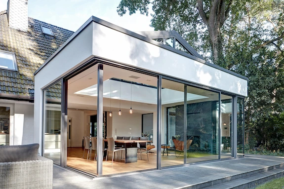 Modern home addition with glass walls and an open-plan living space