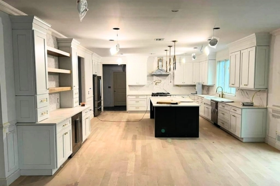 Remodeled kitchen with white cabinets and center island in Trenton, NJ