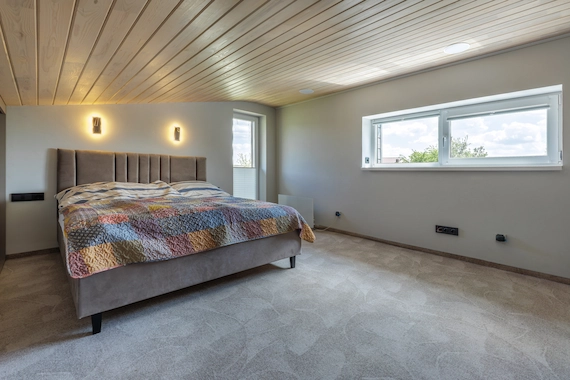 Bedrooms and nurseries featuring professional Carpet Installation Services with soft, wall-to-wall carpeting.