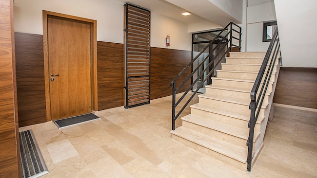 Entryways and mud rooms featuring professional tile flooring installation with tiled stairs.