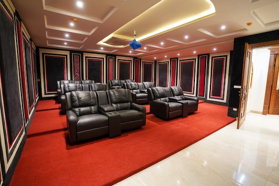 Home theaters and basements featuring professional Carpet Installation Services with red carpeting.