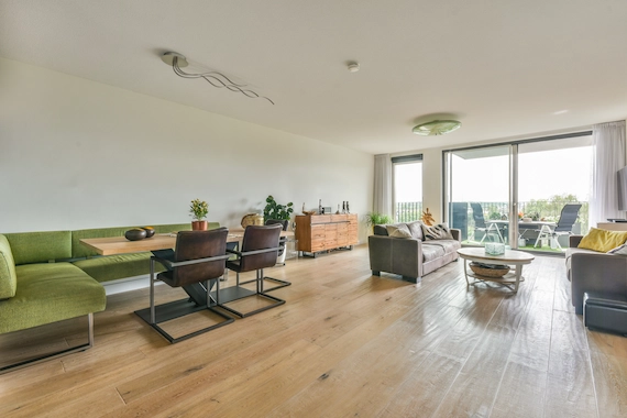 Living rooms and open floorplans with professional luxury vinyl plank (LVP) flooring installation.