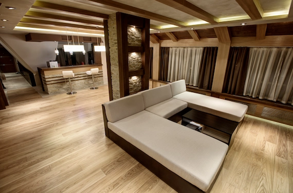 Luxury Vinyl Plank (LVP) flooring installation in a luxury living room with natural wood tones.