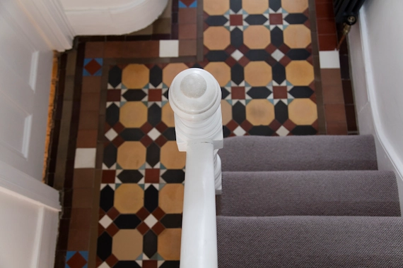 Stairs and hallways featuring professional Carpet Installation Services with carpeted steps.